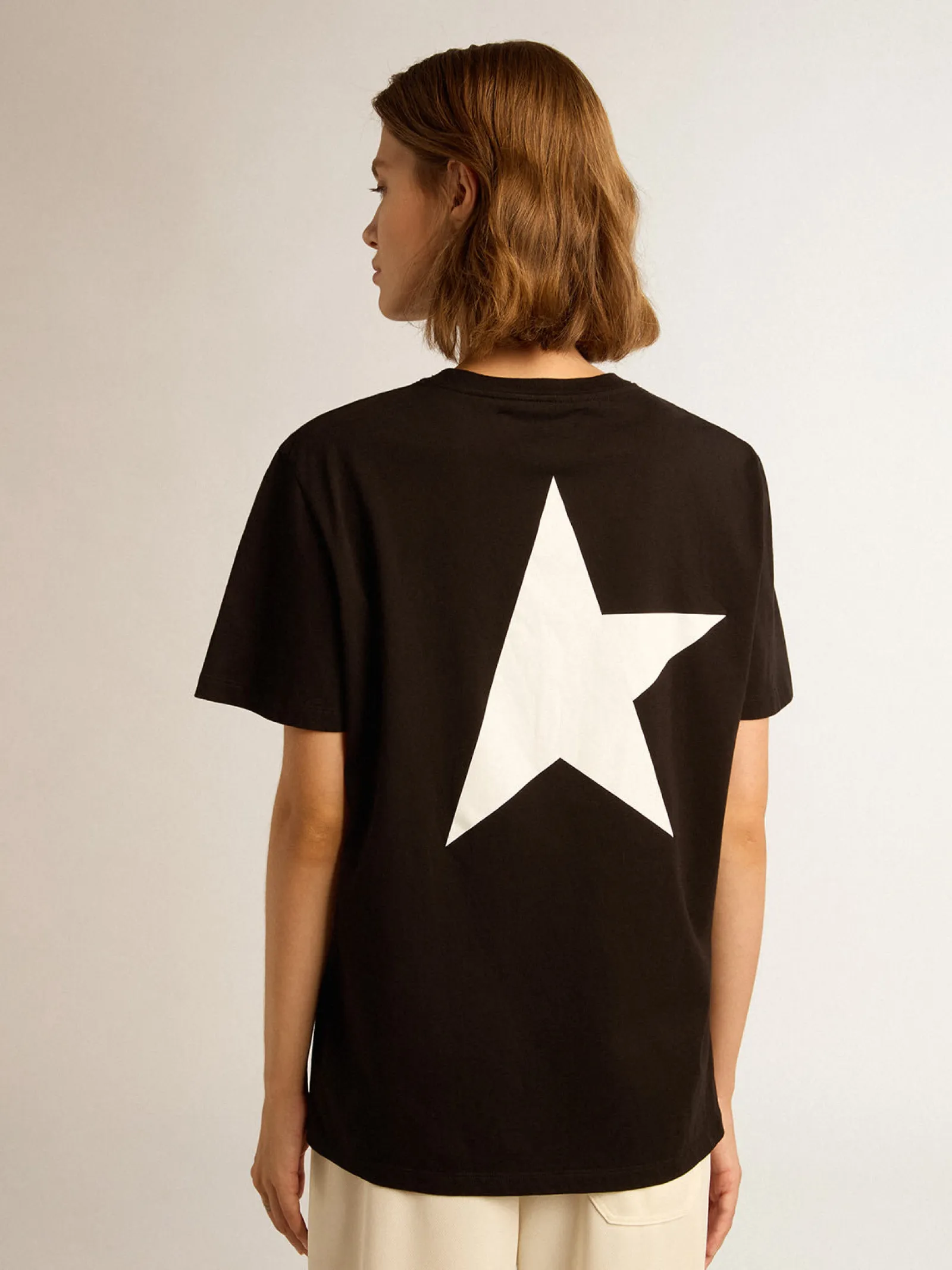 Store Golden Goose Camiseta preta Coleção Star com logo e estrela brancos em contraste Cor: preto