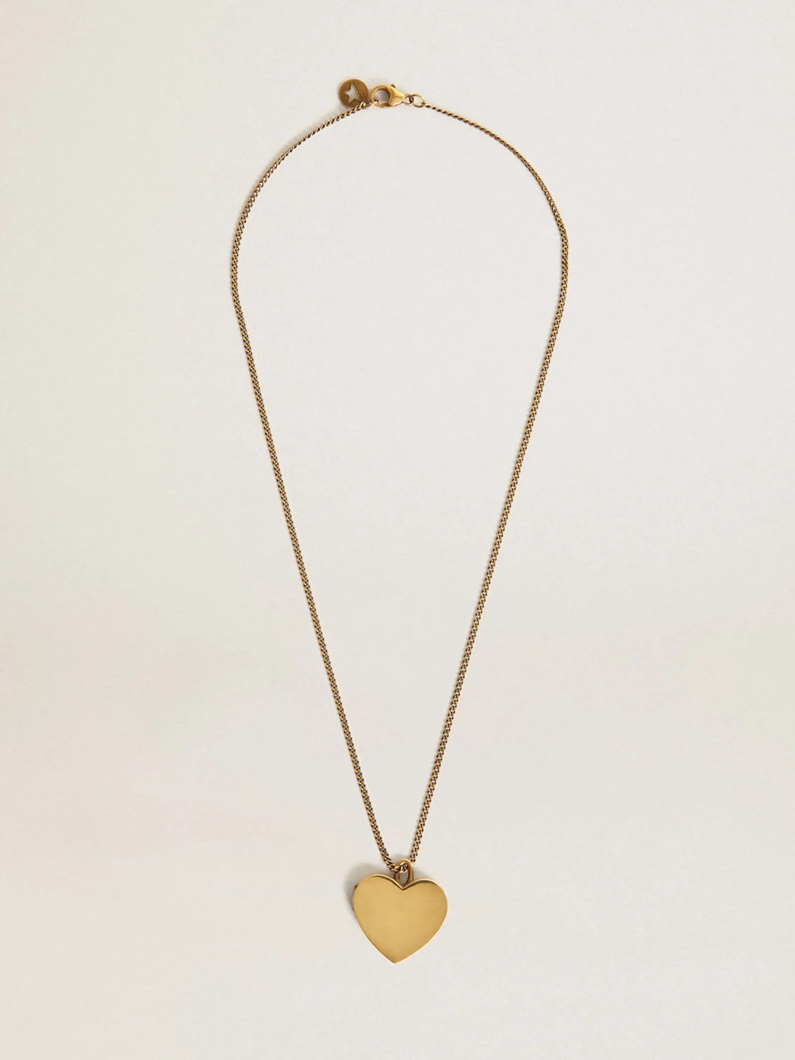 Hot Golden Goose Colar na cor ouro velho com pingente de coração Colar com um pingente em forma de coração que, aberto, revela outro dentro.