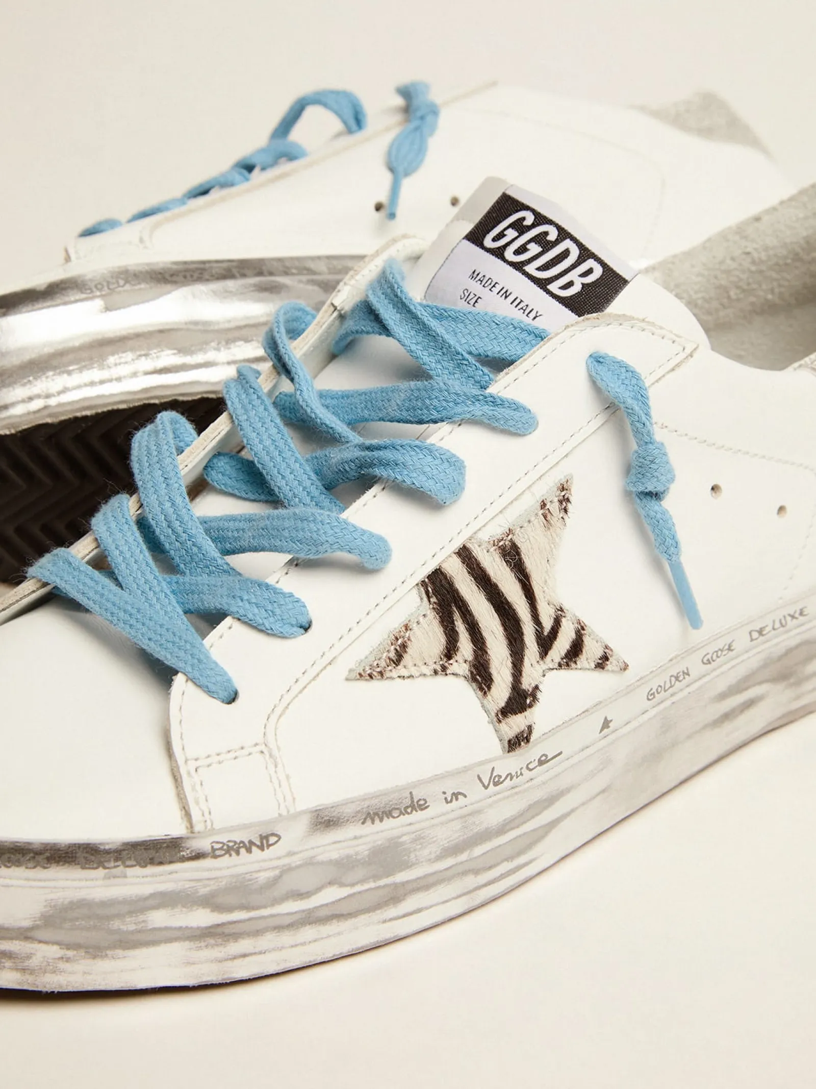 Best Sale Golden Goose Hi Star com estrela de cavalinho com estampa de zebra e talão de glitter Cor: branco