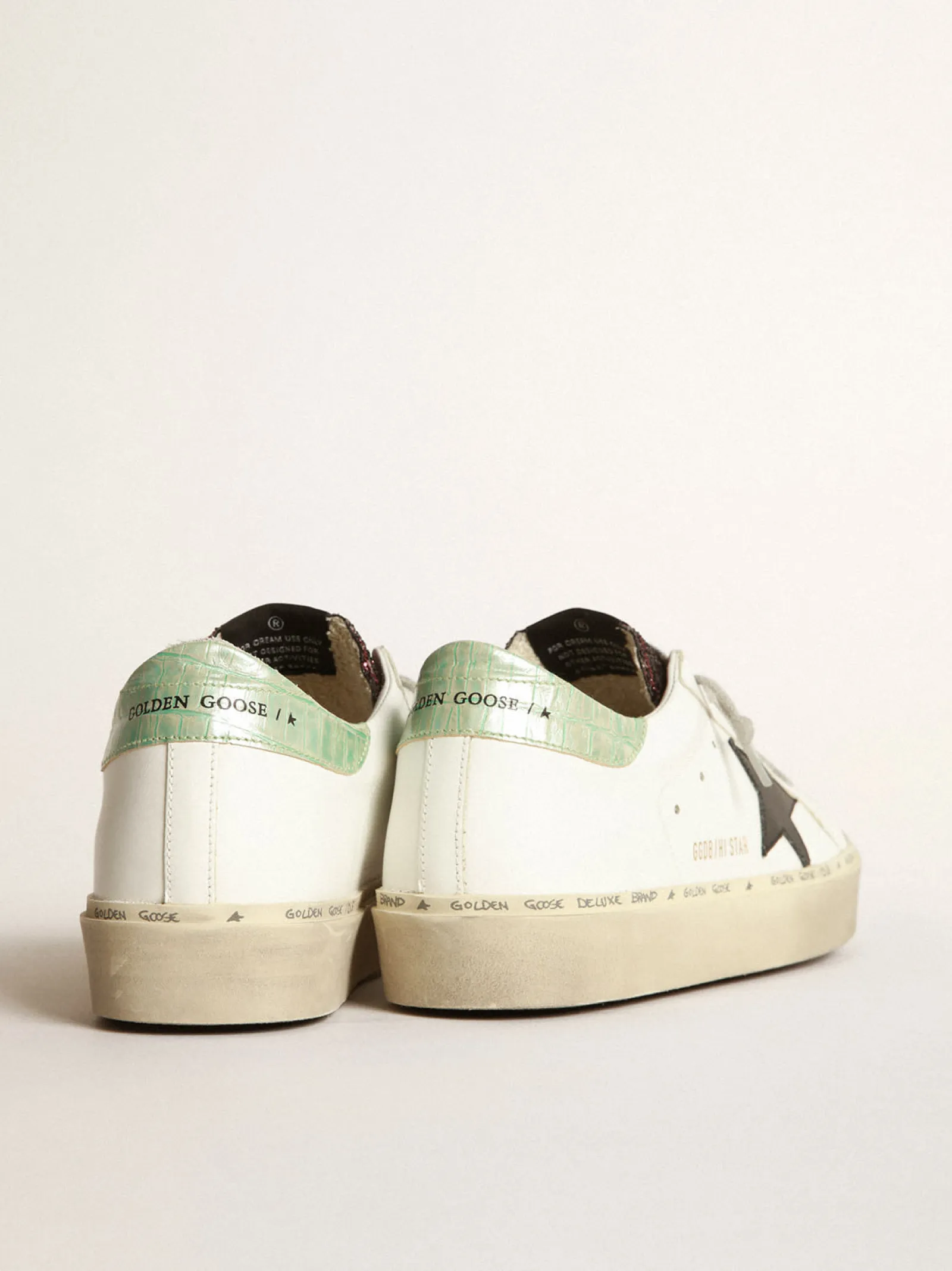 Fashion Golden Goose Tênis Hi-Star branco com inserção de glitter e estrela preta Material principal: 75% couro bovino, 18% polietileno tereftalato, 7% algodão