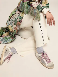 Shop Golden Goose Tênis Super-Star de couro branco e tela prateada Cor: branco e prata